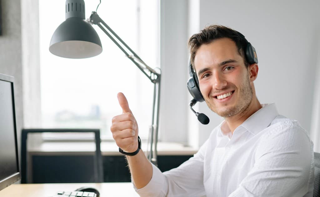 InOps support specialist with headset ,  friendly, professional customer assistance